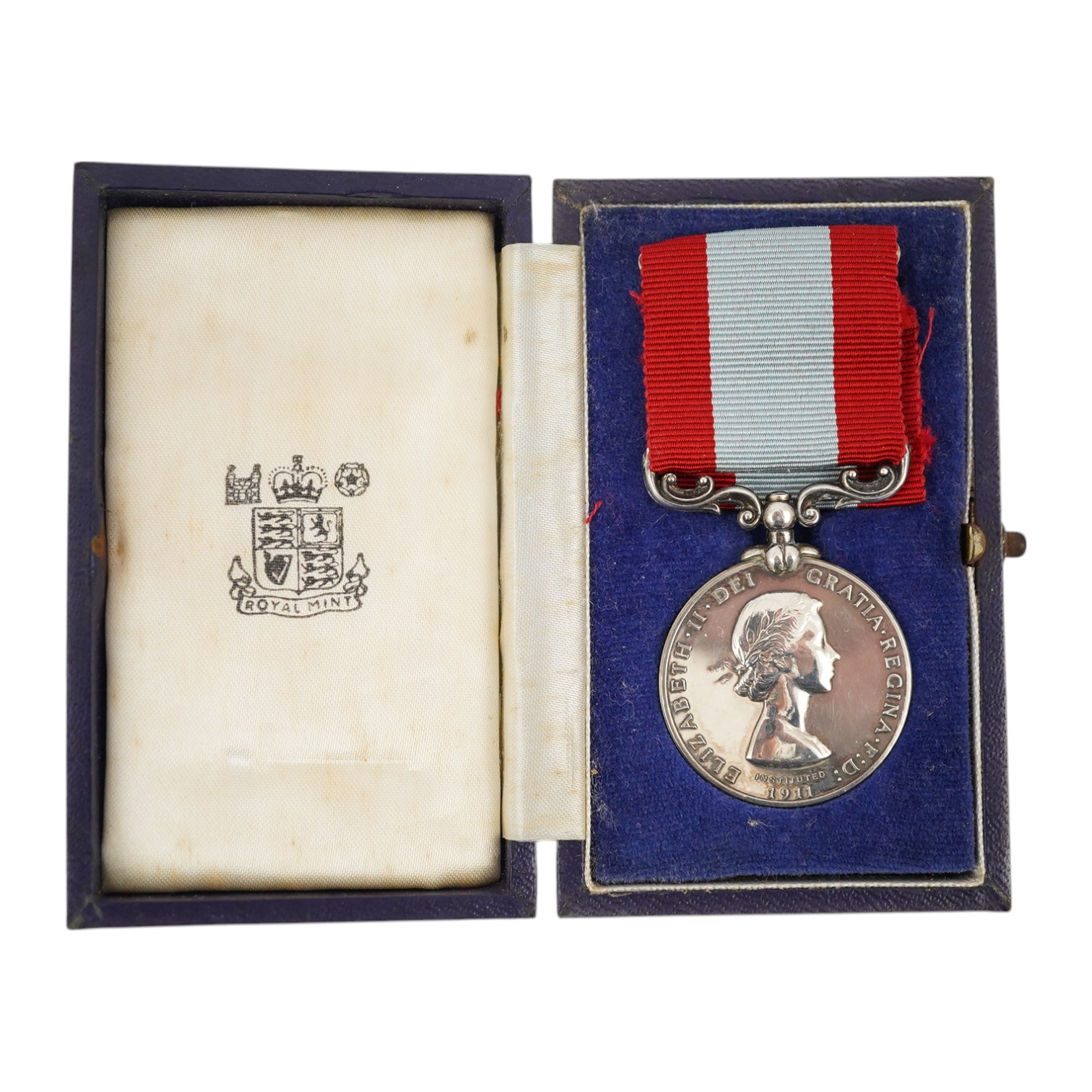 A cased ERII The Coastguard Auxiliary Service Long Service medal, awarded to Eric W. Stephens. Condition - good.